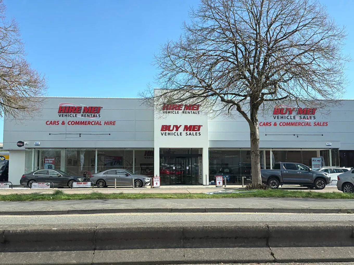 The Cardiff branch forecourt of Hire Me! Vehicle Rentals, with hire and sale vehicles parked outside the showroom.