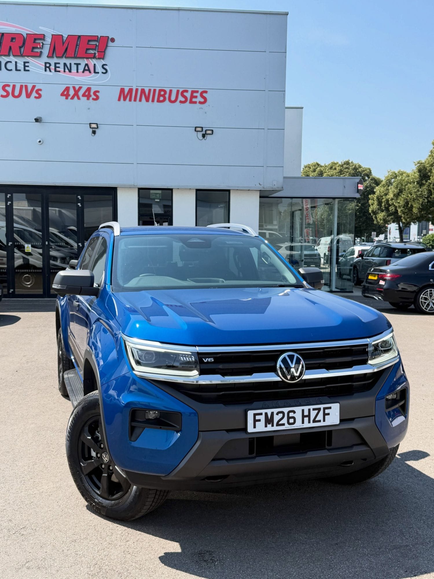 Hire Me Cardiff Branch 4×4 Pickup Hire A blue four-wheel-drive pickup on the forecourt at the Hire Me! Vehicle Rentals branch in Cardiff.