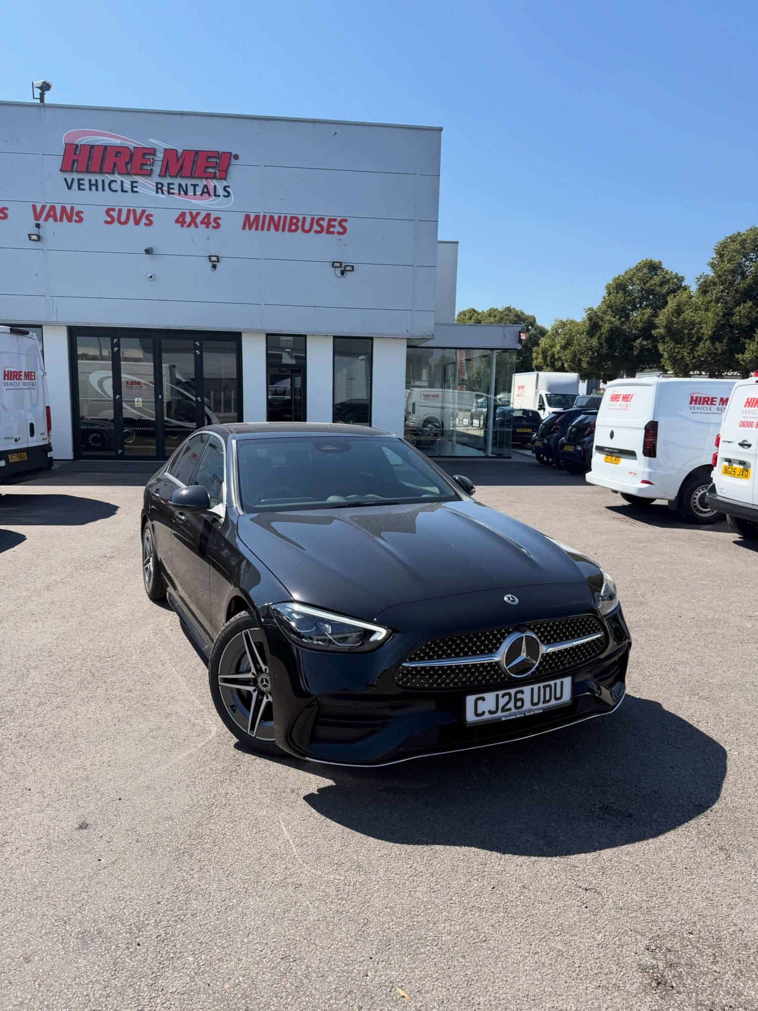Hire Me Cardiff Branch Premium Saloon Hire A black premium saloon on the forecourt at the Hire Me! Vehicle Rentals branch in Cardiff.